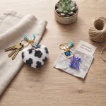 Personalized white leopard plush heart keychain with blue acrylic letter for backpack