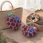Personalized fuchsia plush heart keychain with blue acrylic letter for backpack