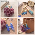 Personalized fuchsia plush heart keychain with blue acrylic letter for backpack