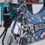 Vintage braided keychain with antique silver charms and star mirror, black and white paracord bag charm.