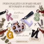 Close-up of the initial heart keychain showing leopard faux fur heart and stitched PU leather letter.