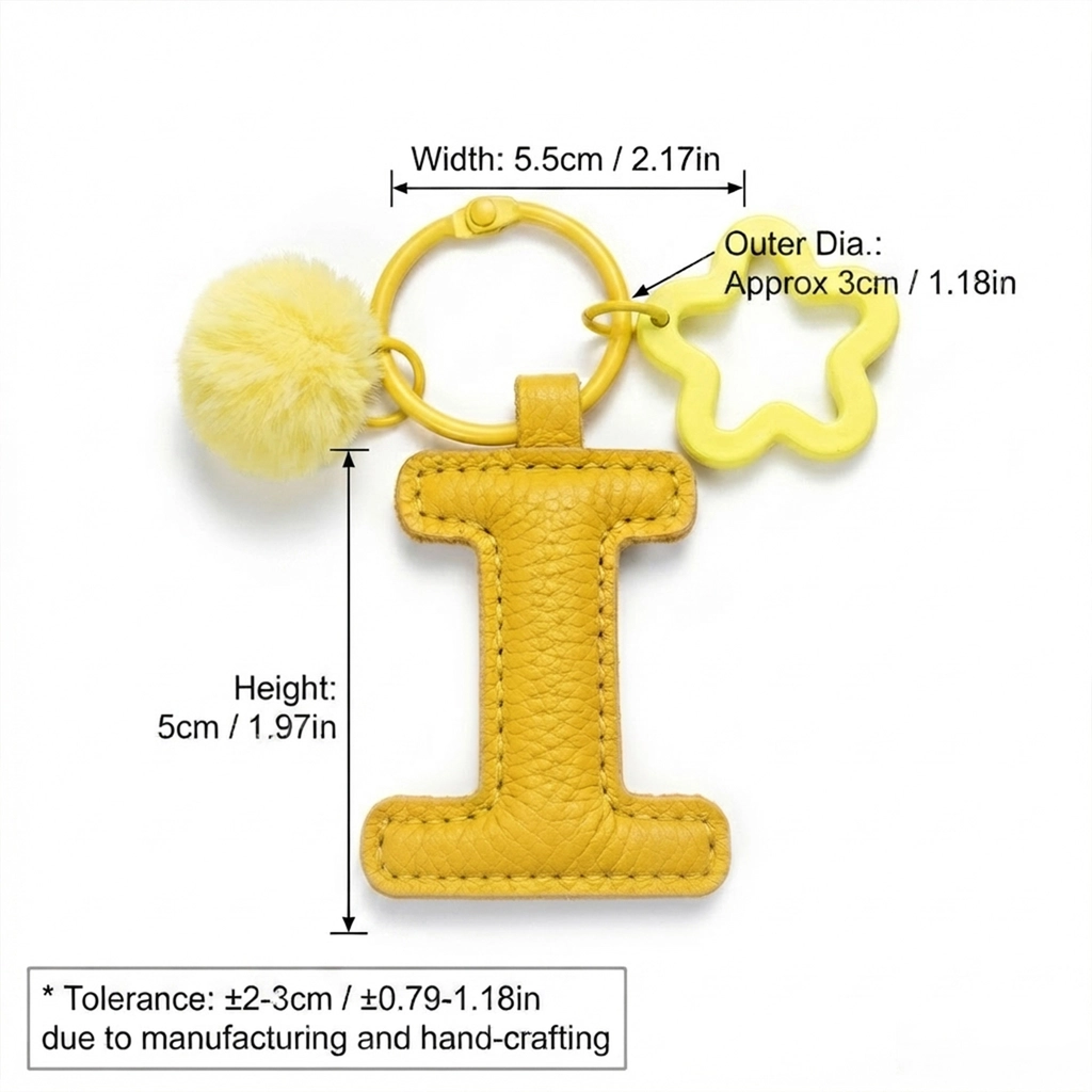 Close-up of the Letter I keychain showing padded sunshine yellow PU leather and soft faux fur pom pom.