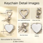 Open folding compact mirror inside the silver heart mirror keychain showing clear HD glass.