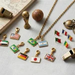Close-up of the travel flag charm showing glossy epoxy resin surface and gold plated edge.