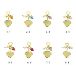 8 color variations of gold heart locket keychain with cute strawberry charms.