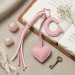 Personalized initial heart keychain in pink PU leather with letter B cutout.