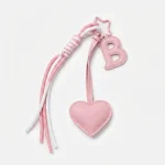 Personalized initial heart keychain in pink PU leather with letter B cutout.