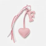 Personalized initial heart keychain in pink PU leather with 26 letters cutout.