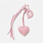 Personalized initial heart keychain in pink PU leather with 26 letters cutout.