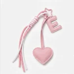 ersonalized initial heart keychain in pink PU leather with 26 letters cutout.